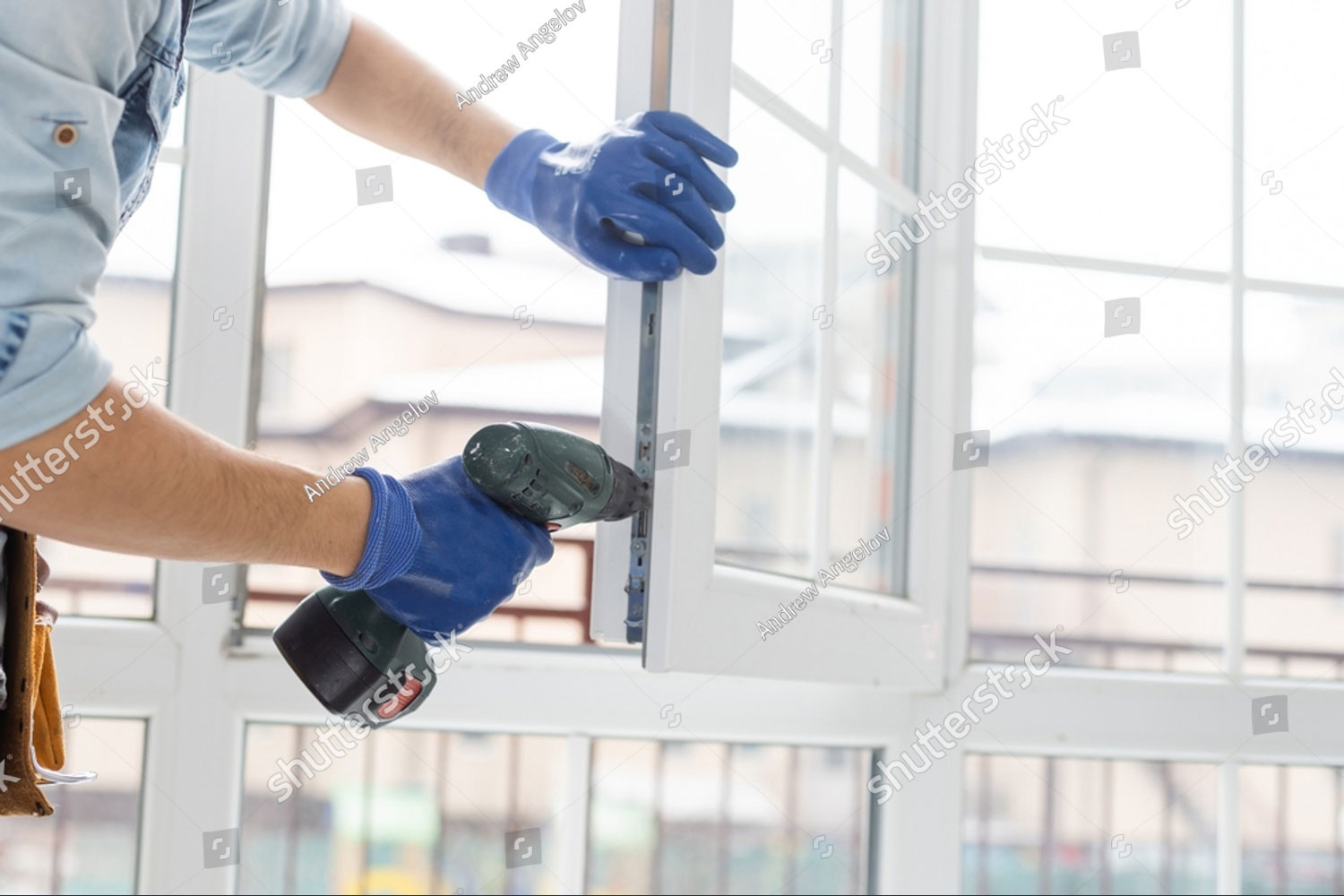 A worker installing windows