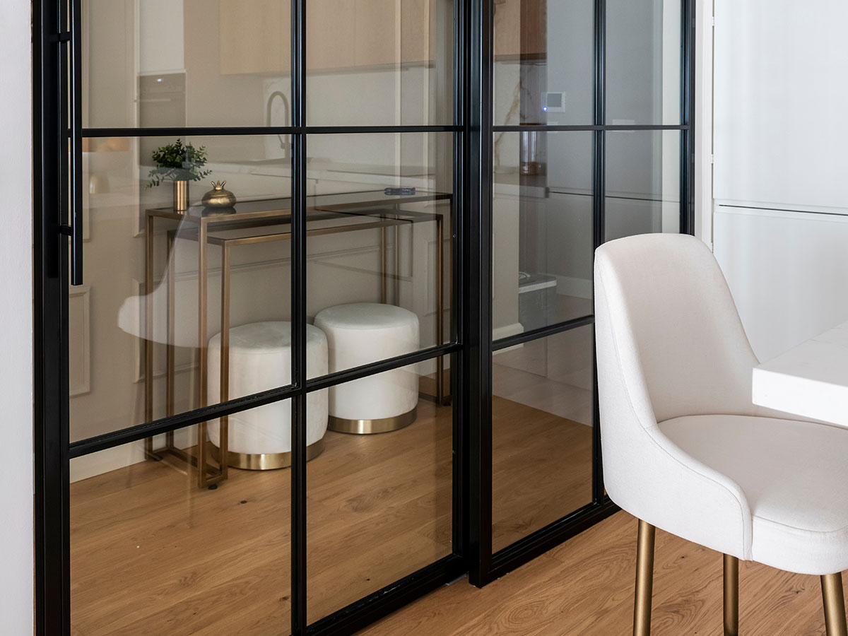 Slim sliding doors with aluminium frames and glass panels